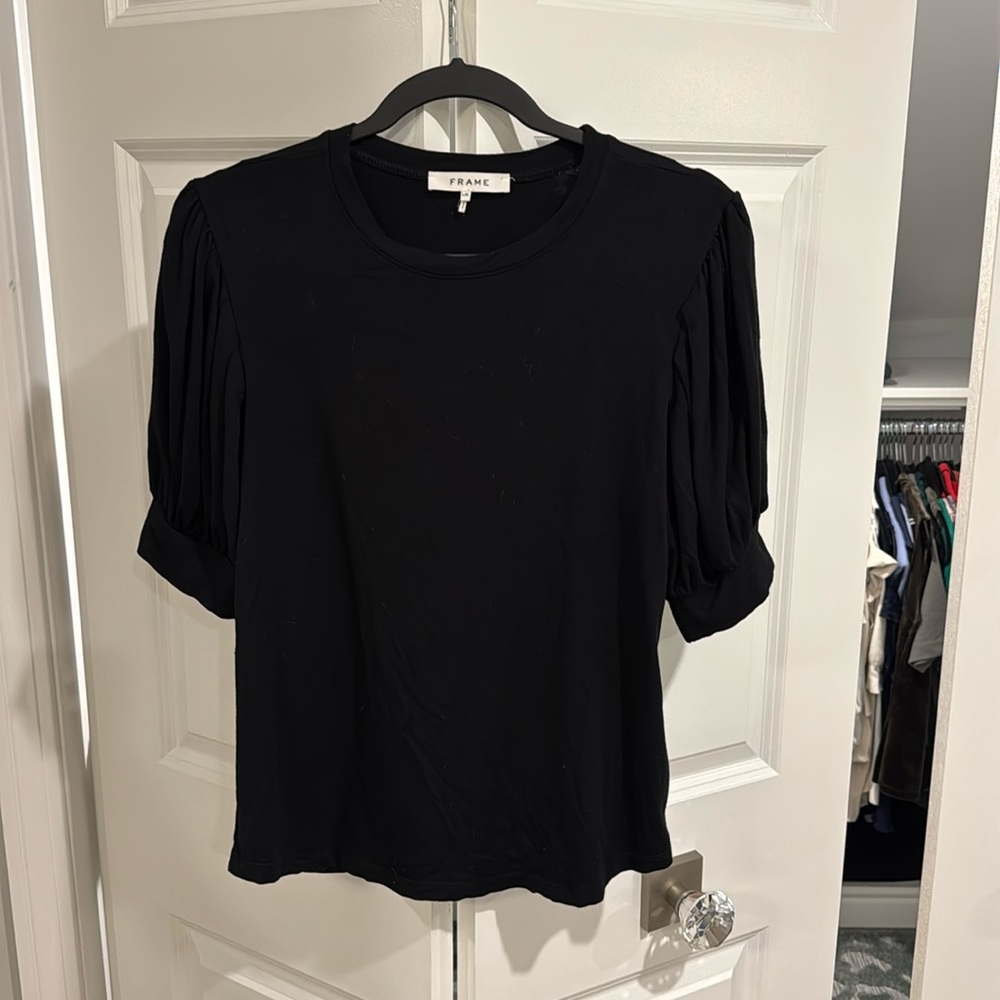 Brand: Frame 
Black blouse with subtle puff sleeve 
Excellent condition